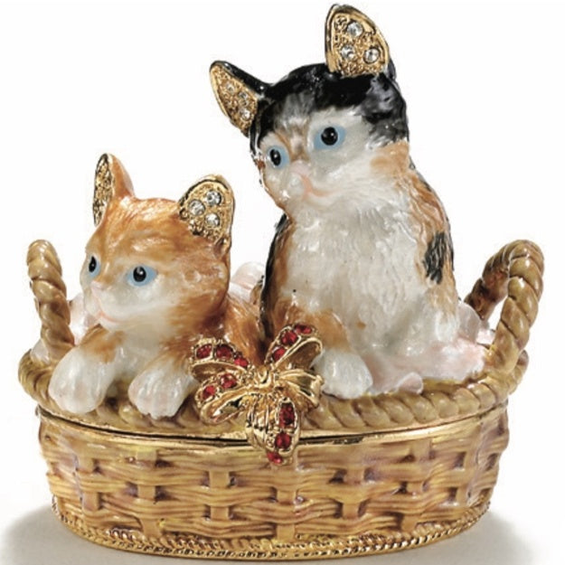 Decorative figurine of two cats in a basket with jewelry on a white background