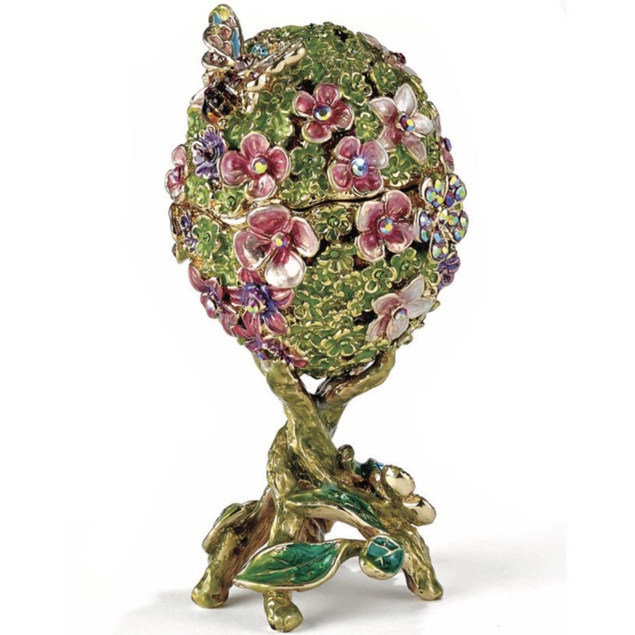 Decorative egg-shaped trinket box with floral designs and a butterfly on a white background