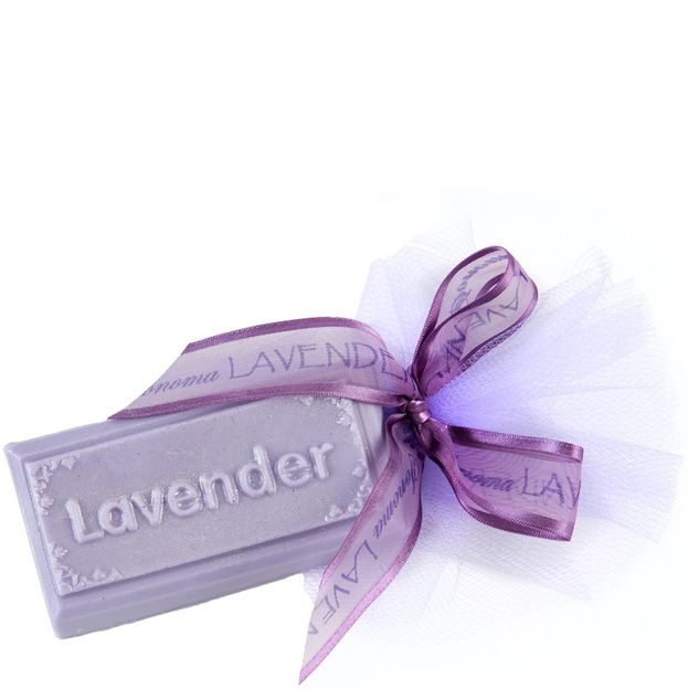 Lavender soap bar with a decorative ribbon on a white background