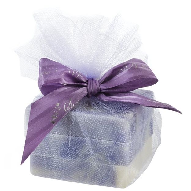 Gift box with purple ribbon and sheer wrap on a white background