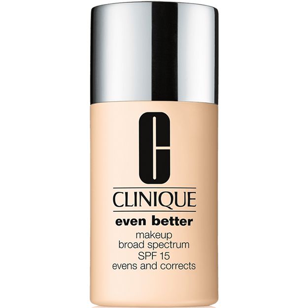 Clinique foundation bottle with beige body and silver cap on a white background