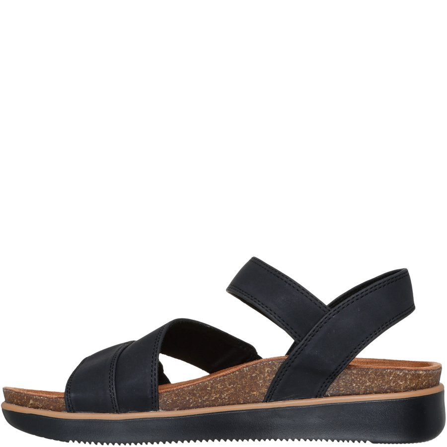 Black sandal with cork sole on a white background