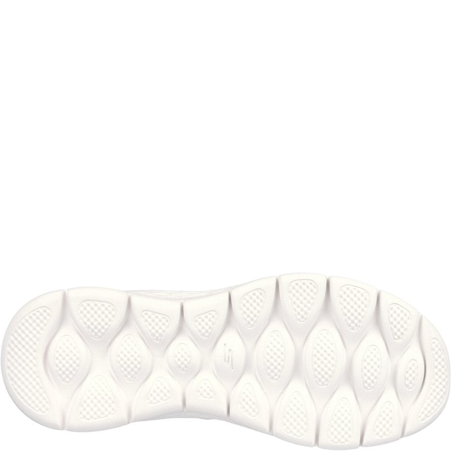 Close-up of a white shoe sole with tread pattern on a white background