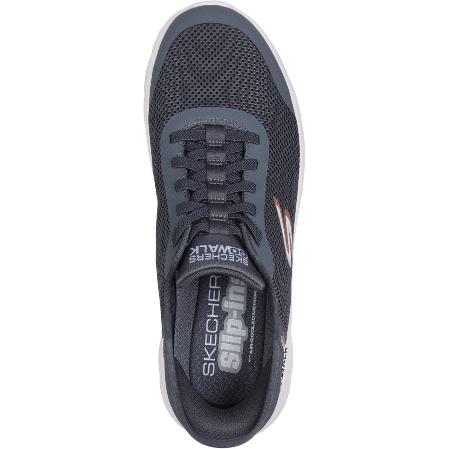 Gray sneaker with 'Skechers' branding on a white background