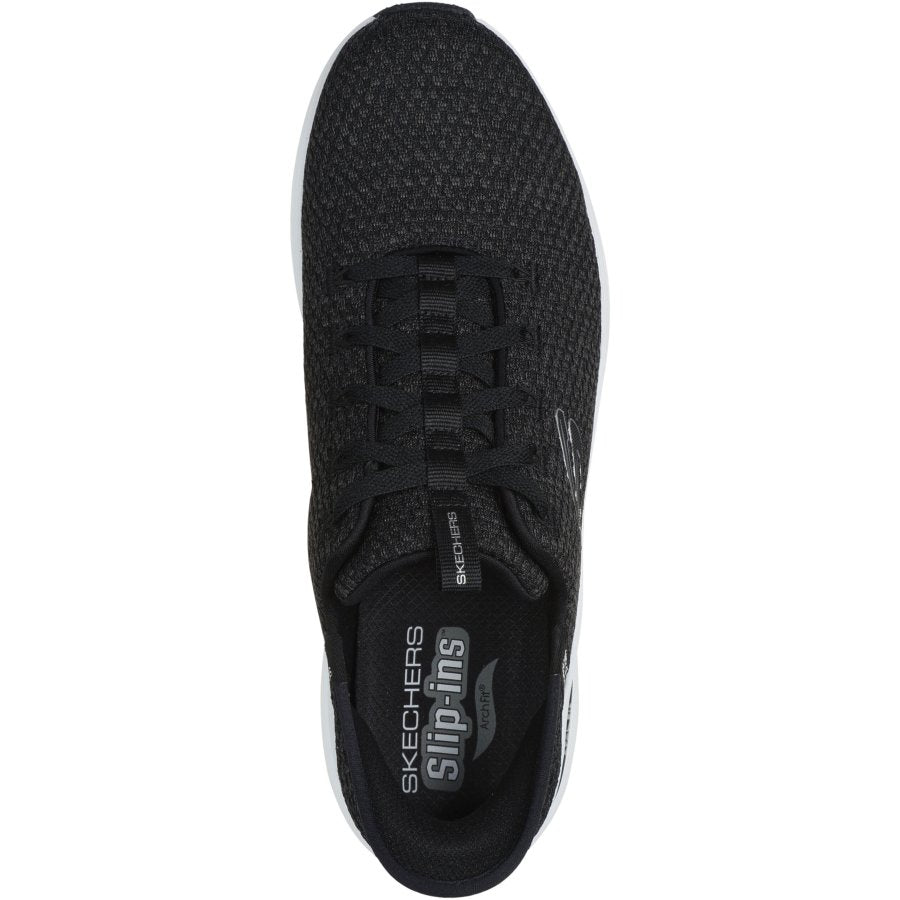 Black sneaker with 'Skechers' branding on a white background
