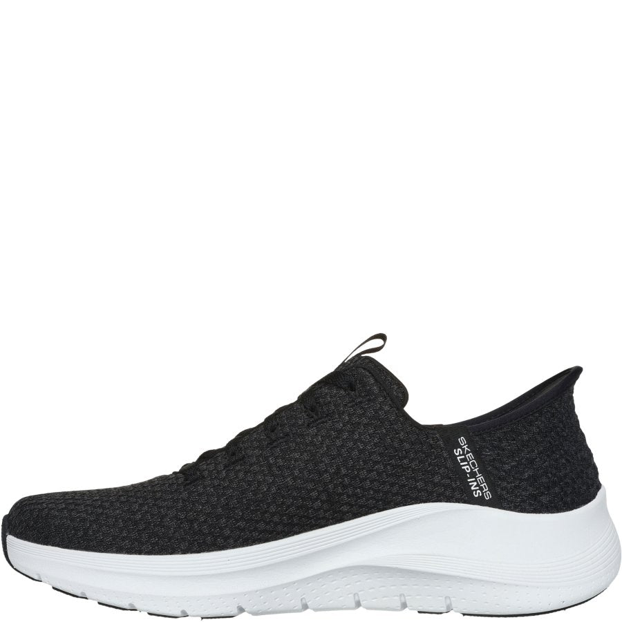 Black athletic shoe with white sole on a white background