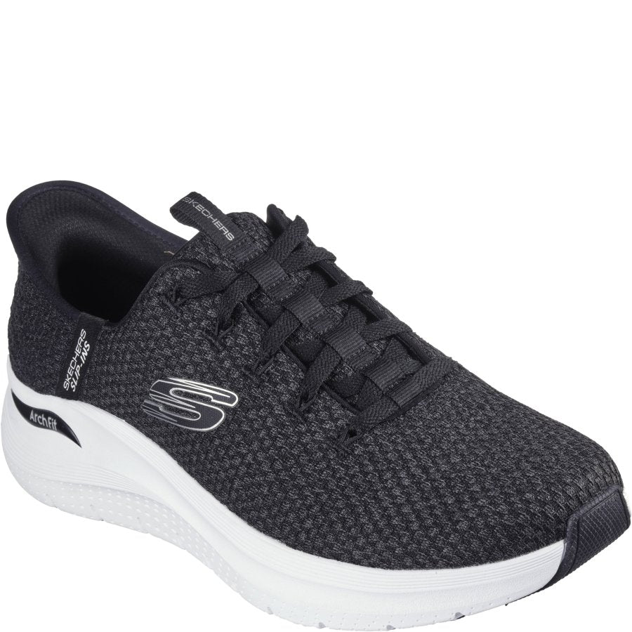 Black sneaker with white sole on a white background