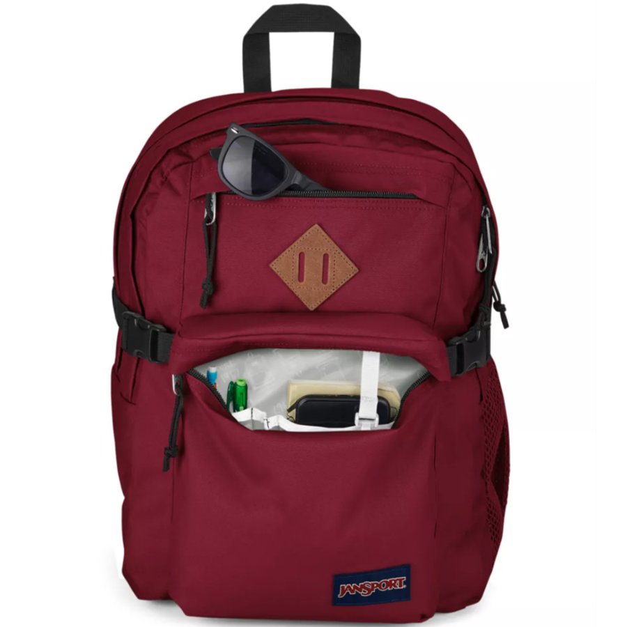 Maroon Jansport backpack with a visible brand logo on a white background