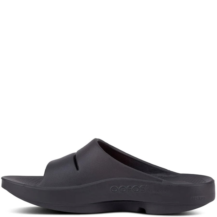 Black slide sandal on a white background