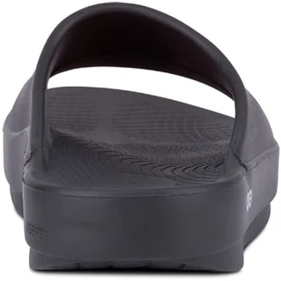 Black slide sandal on a white background