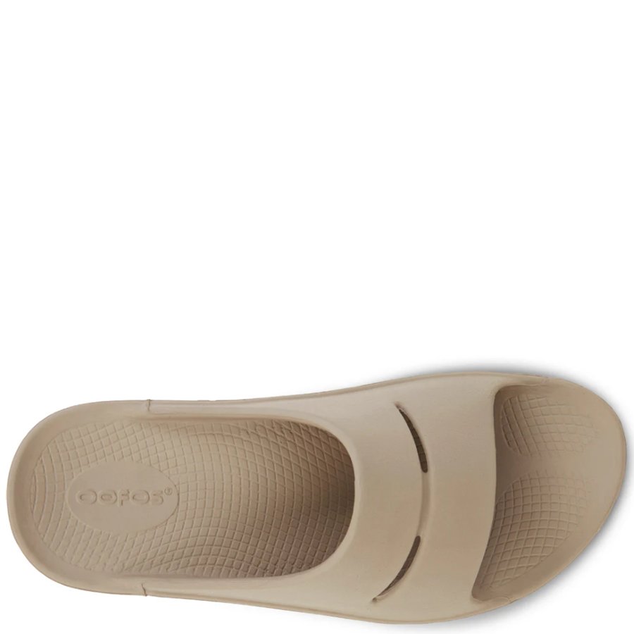 Beige sandal with a visible brand logo on a white background