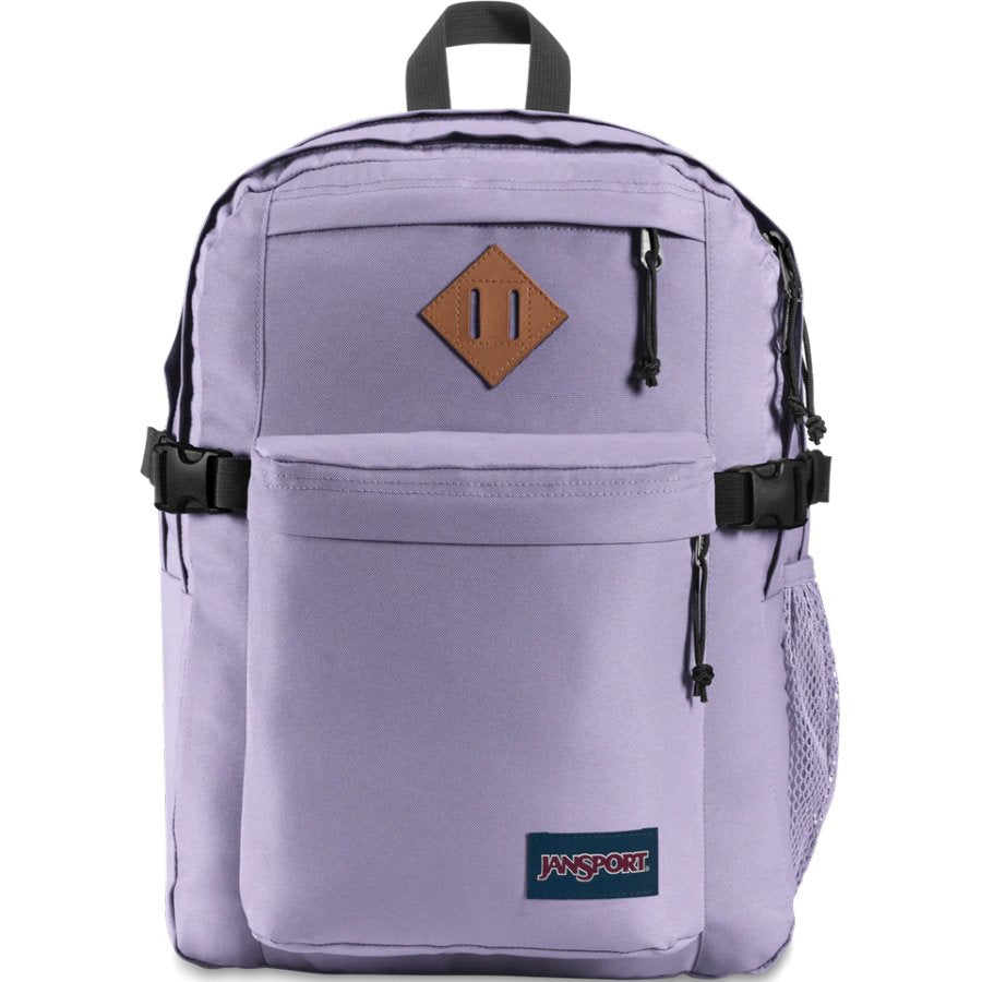 Purple backpack with a brown leather patch and Jansport logo on a white background