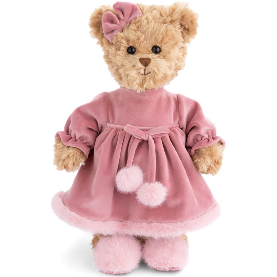 Teddy bear wearing a pink dress with pom-poms on a white background