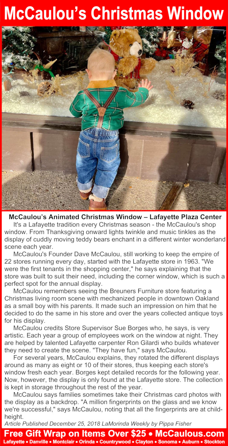 Animated Christmas window display with a child and teddy bear at McCaulou's Animated Christmas Window in Lafayette Plaza Center.