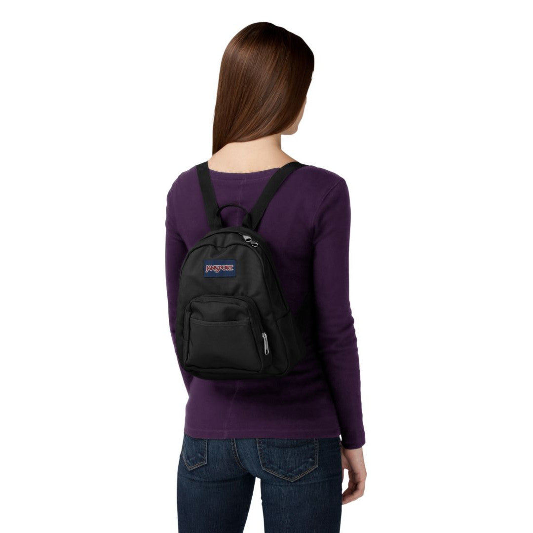 Person wearing a black Jansport backpack with a visible brand logo on a white background