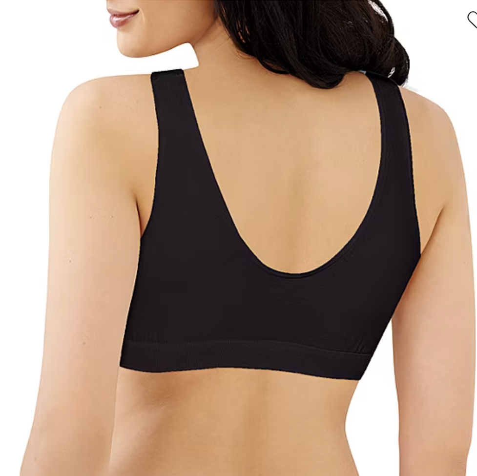 Black sports bra worn by a person on a white background
