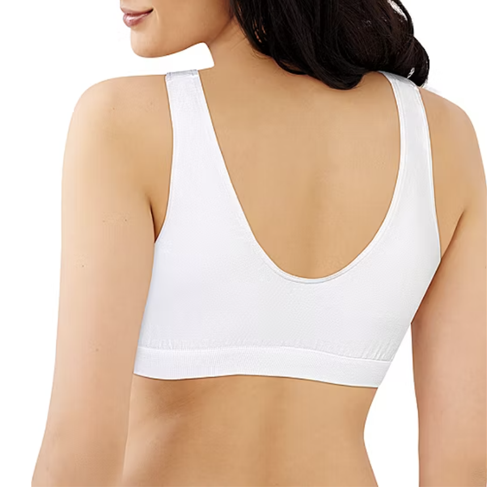 White sports bra worn by a person on a white background