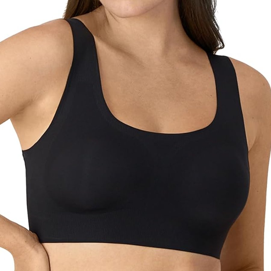 Black sports bra worn by a person on a white background