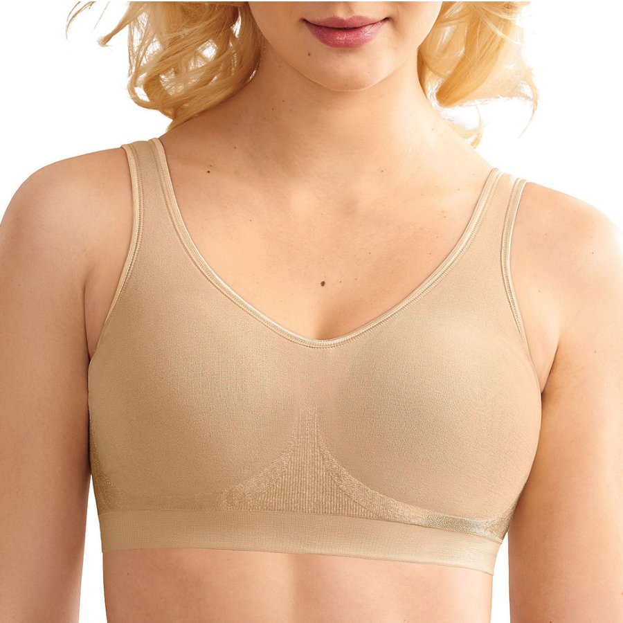 Beige tank top worn by a person on a white background