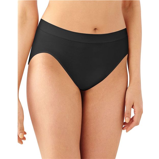 Black bikini bottom worn by a person on a white background