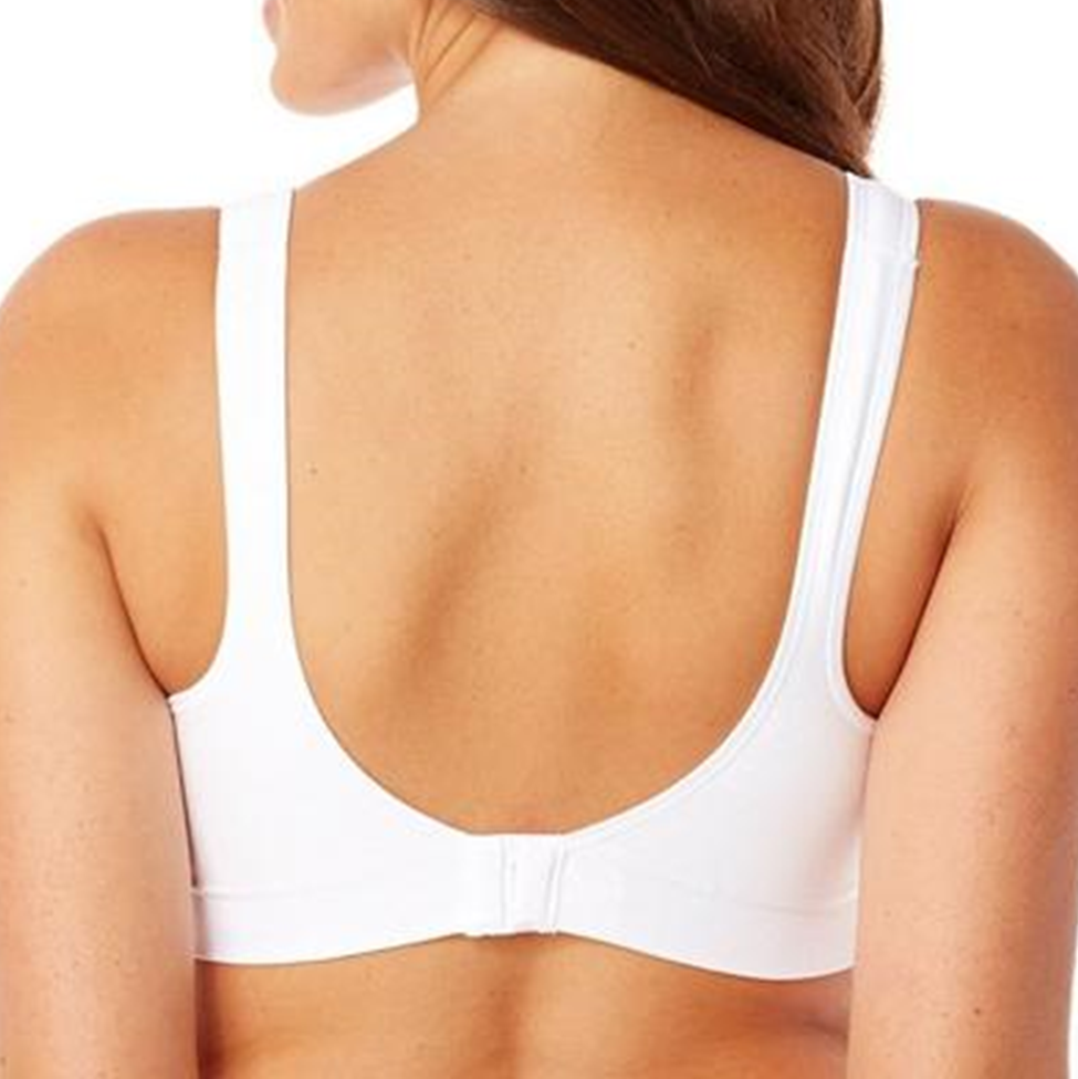 White bra worn by a person on a white background