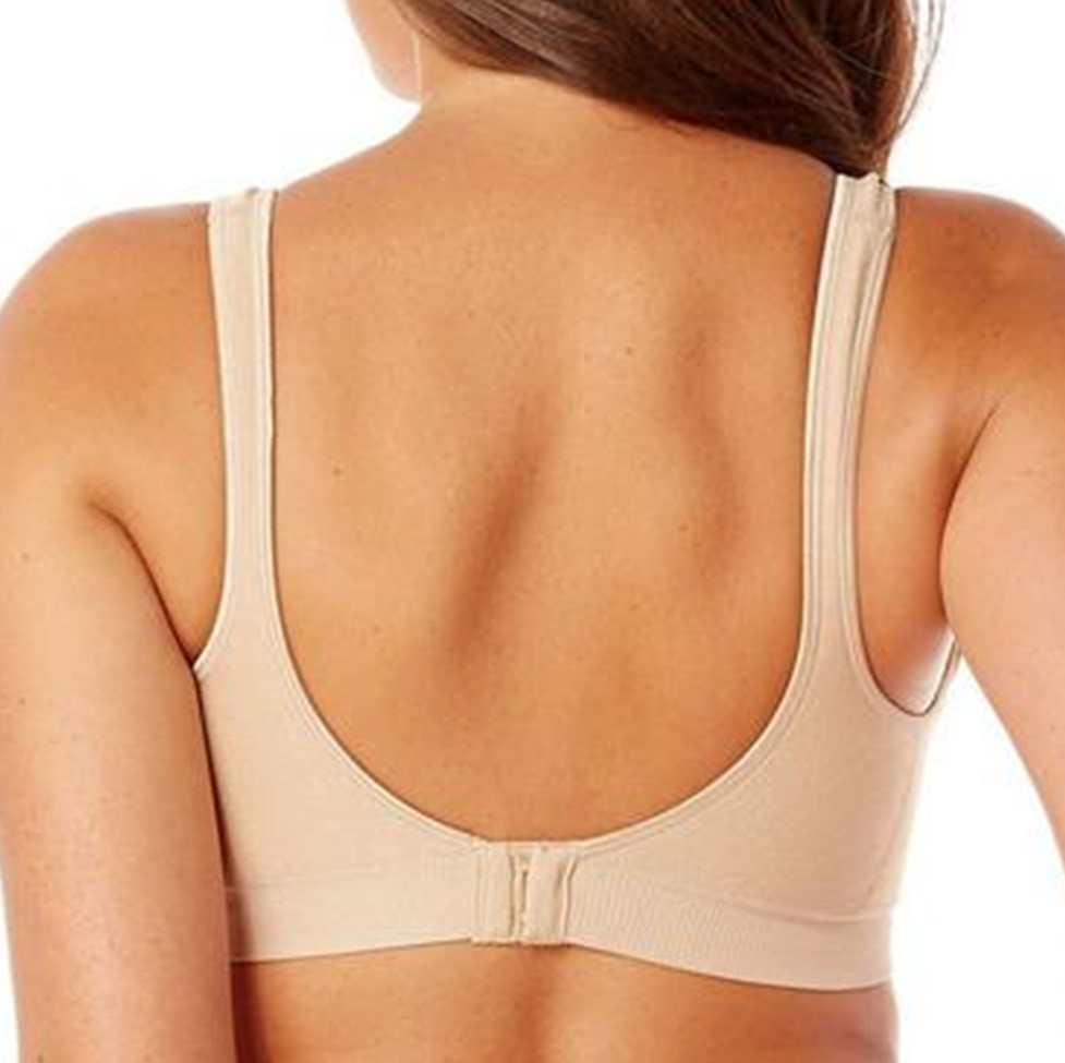 Beige bra worn by a person on a white background