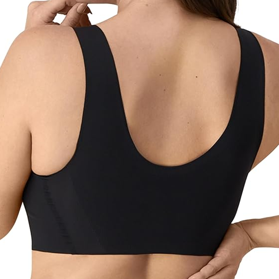 Black sports bra worn by a person on a white background