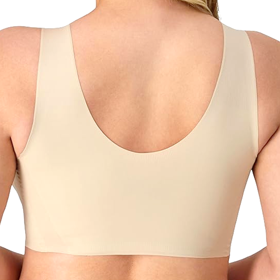 Beige sports bra worn by a person on a white background