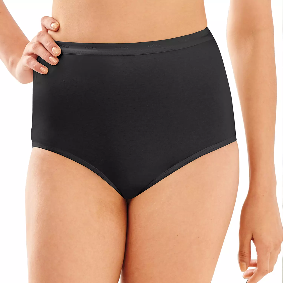 Black high-waisted underwear worn by a person on a white background