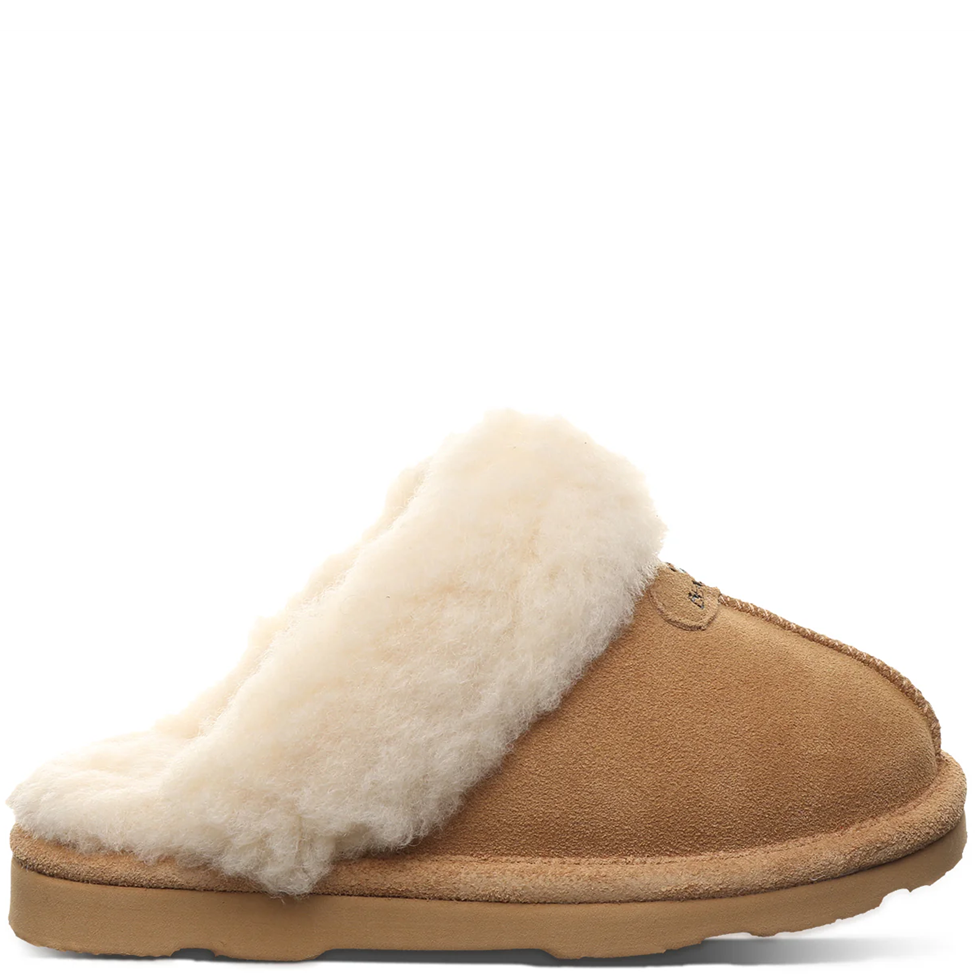 Brown slipper with white fur lining on a white background