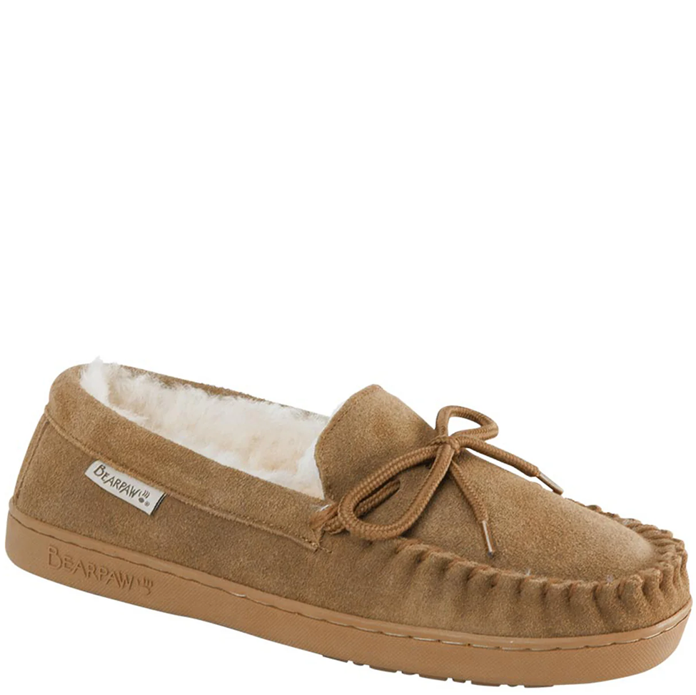 Brown moccasin slipper with white fur lining on a white background