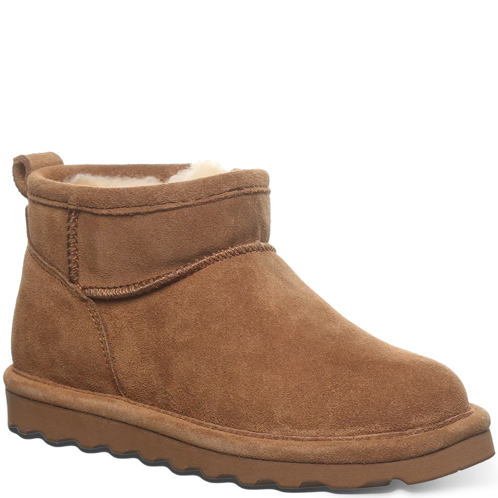 Brown suede ankle boot with fur lining on a white background