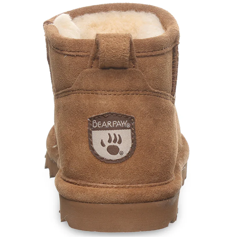Brown suede boot with white fur lining and Bearpaw logo on a white background