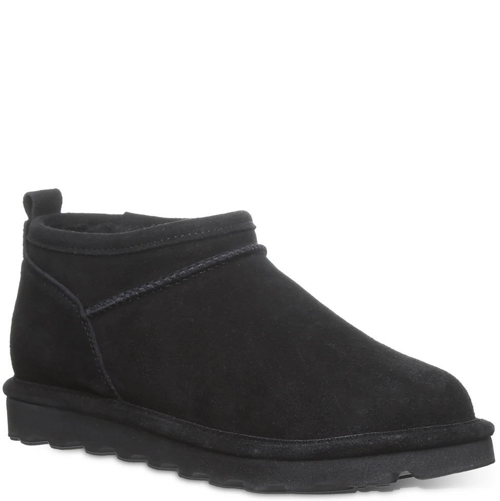 Black suede ankle boot on a white background