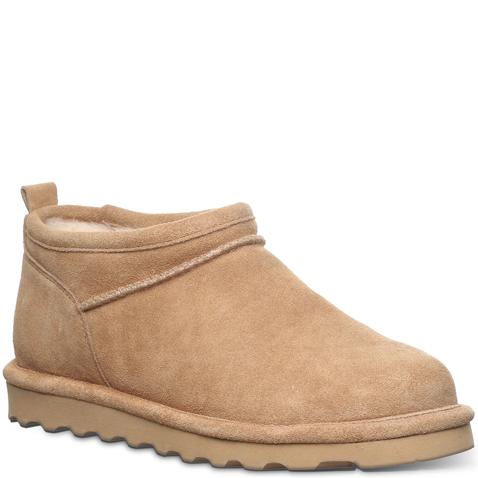 Tan suede ankle boot on a white background
