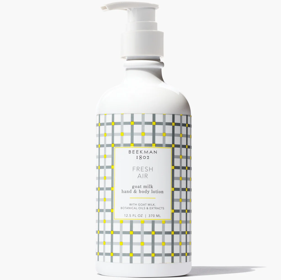 Bottle of Beekman 1802 Fresh Air goat milk hand & body wash on a white background