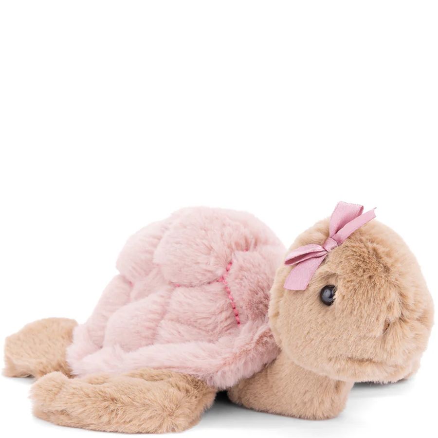 Plush turtle toy with pink shell and bow on a white background