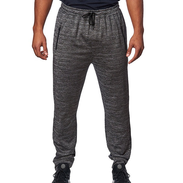 Gray jogger pants worn by a person on a white background