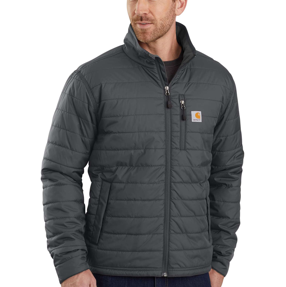 Man wearing a dark gray quilted jacket with a brand logo on a white background