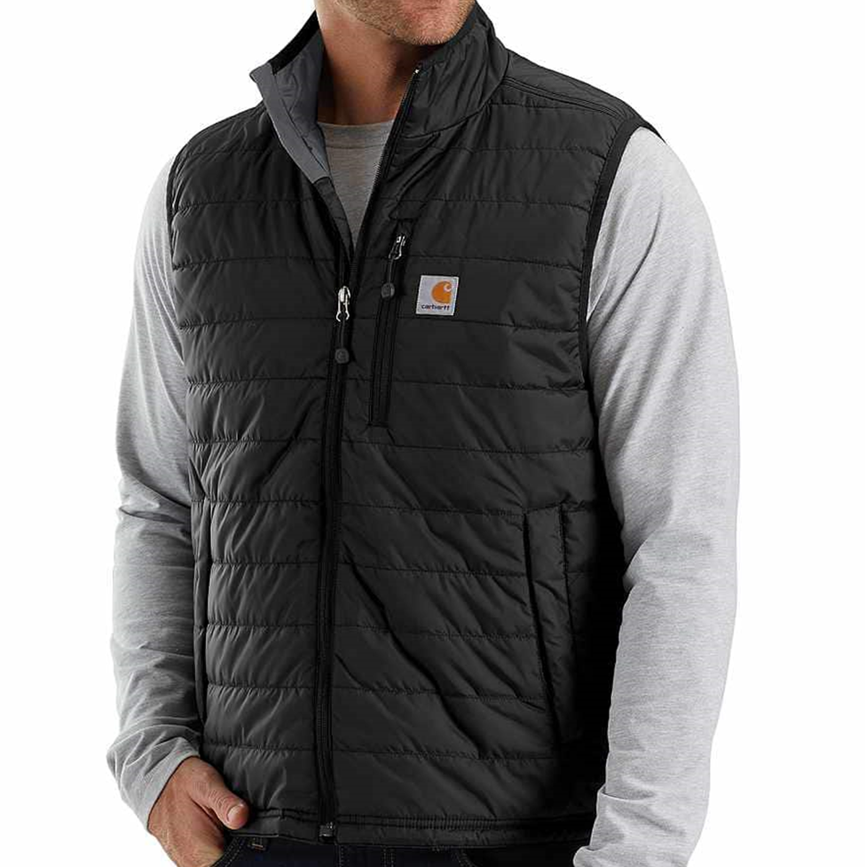 Man wearing a black quilted vest with a visible brand logo on a white background