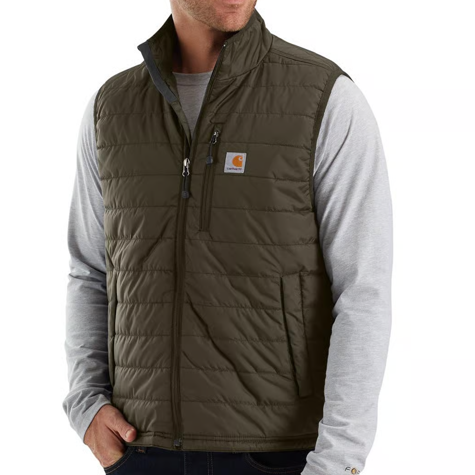 Man wearing a brown quilted vest with a visible brand logo on a white background