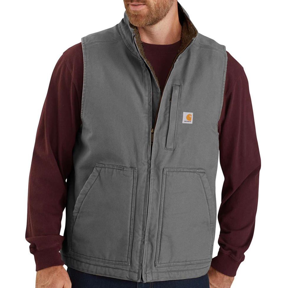 Man wearing a gray vest over a maroon long-sleeve shirt on a white background