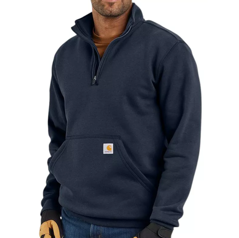 Person wearing a navy blue pullover with a visible brand logo on a white background