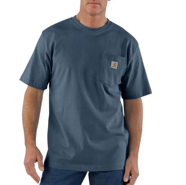 Man wearing a blue t-shirt with a pocket on a white background
