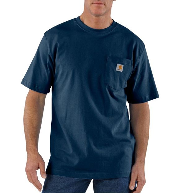 Man wearing a navy blue t-shirt with a Carhartt logo on a white background