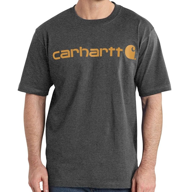 Person wearing a dark gray t-shirt with Carhartt logo on a white background