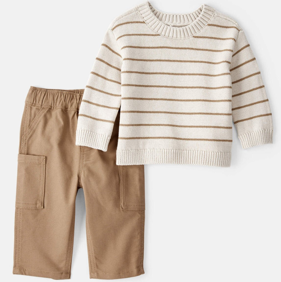 Children's outfit with striped sweater and beige pants on a white background