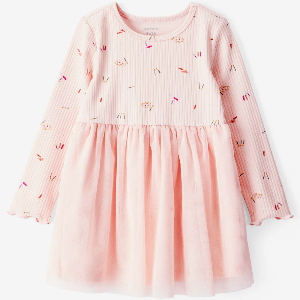 Pink dress with long sleeves and a pattern on a white background