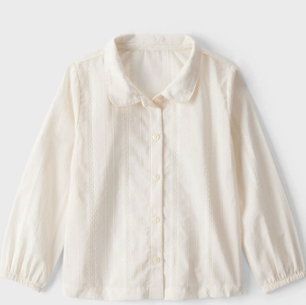 White button-up shirt on a light gray background