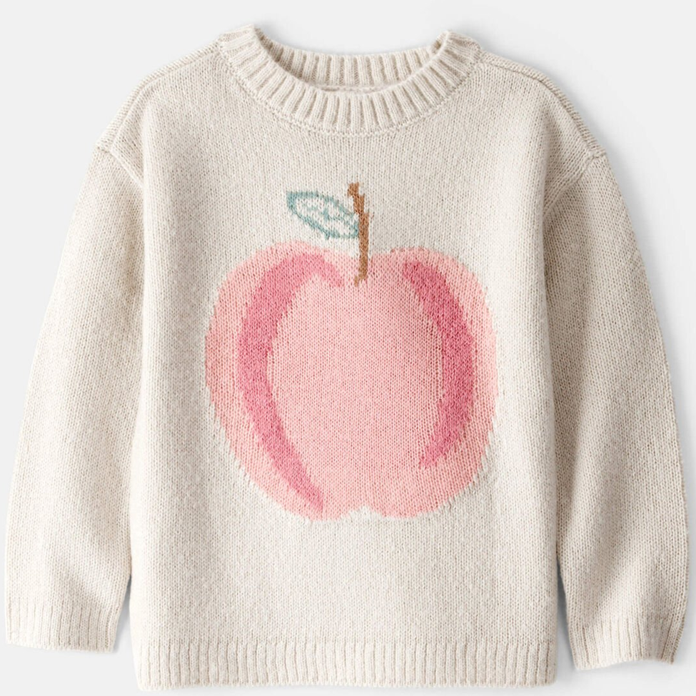 Beige sweater with a pink apple design on a white background
